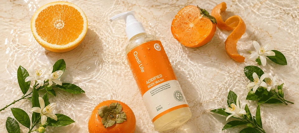 qualilife_persimmon_body_wash_with_persimmon_and_ingredient_elements_on_water