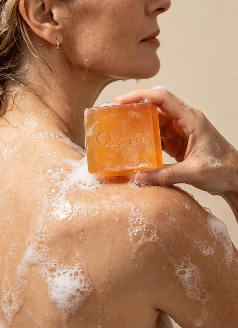 woman_showering_with_qualilife_persimmon_soap